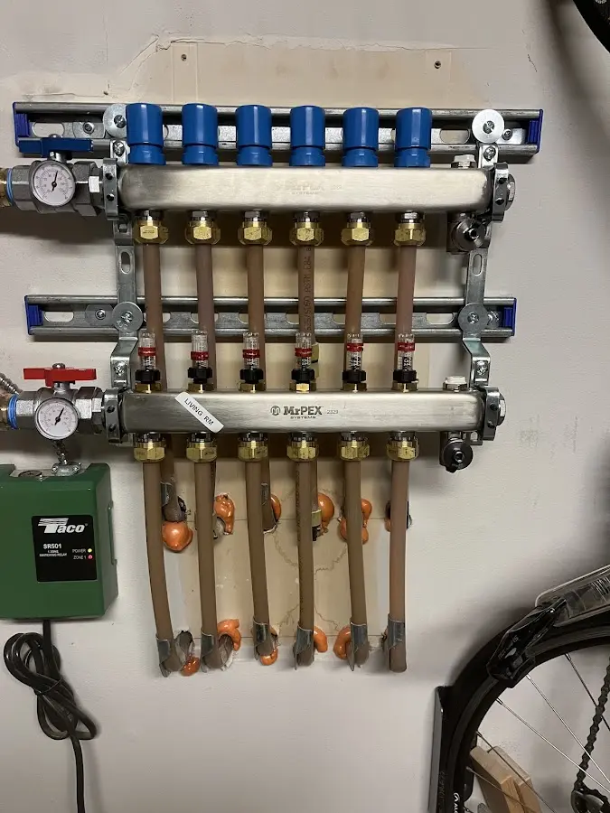 Plumber performing Water Heater Repair at a residential property in Charles City